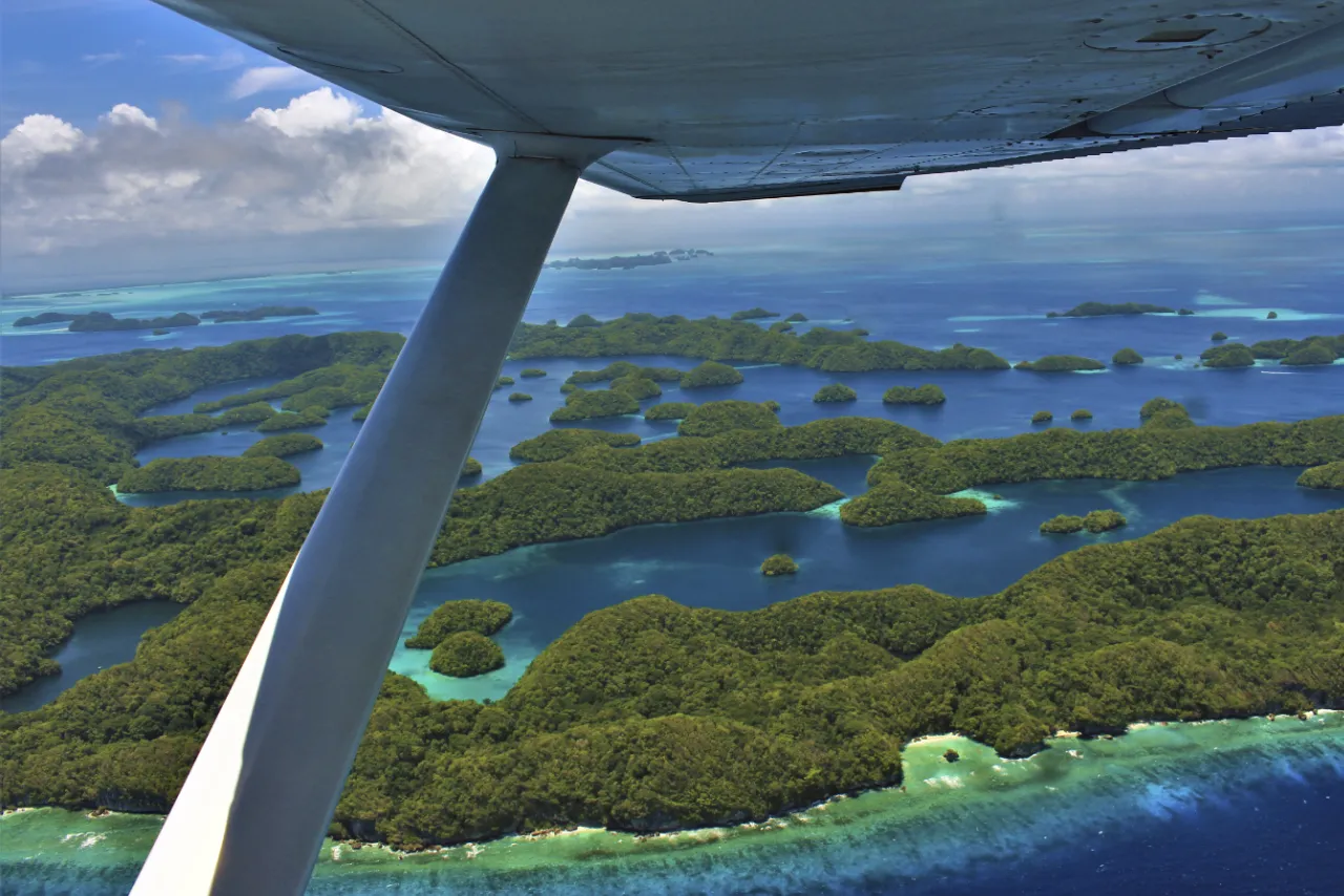 Aerial photo of the 70 islands in Palau showing an abundance of green islands in blue waters