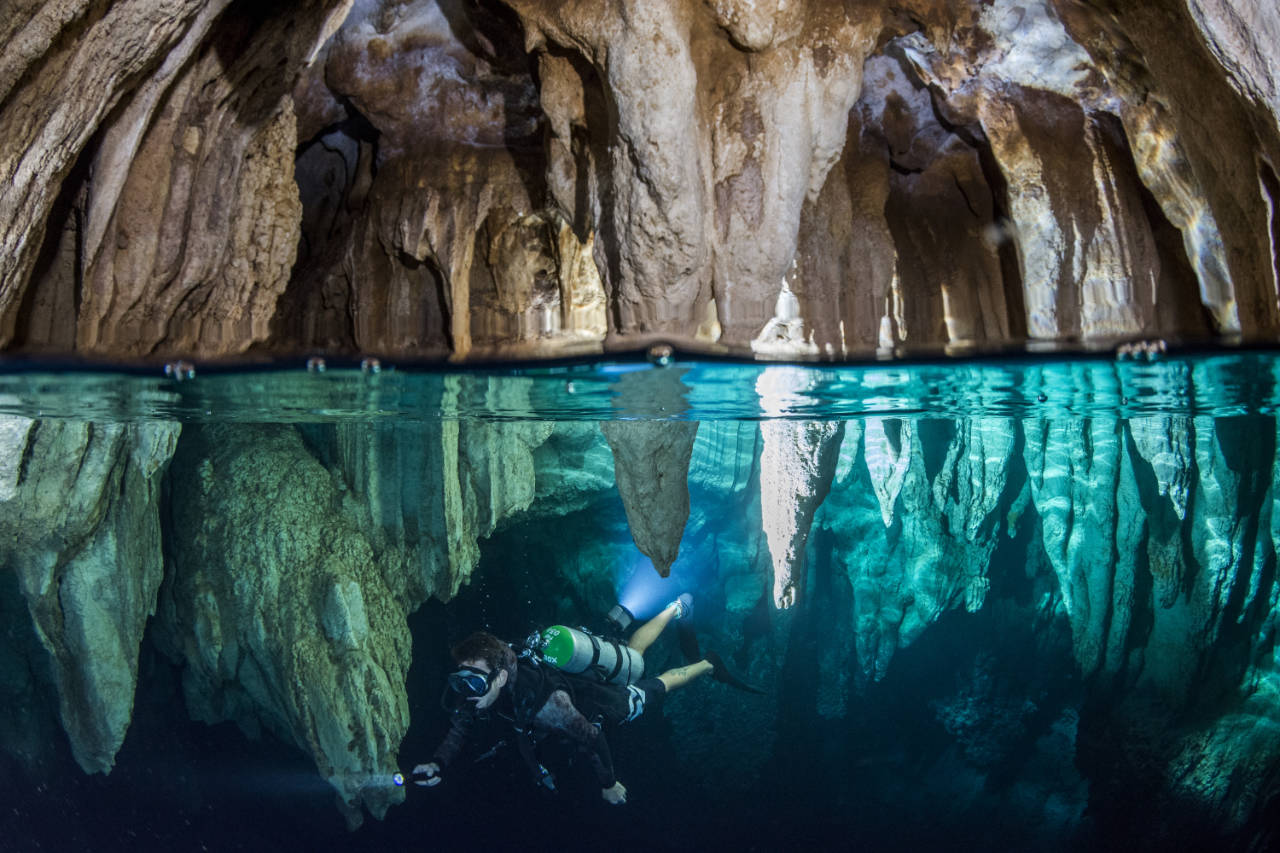 diver underwater at Chandelier Cave in Palau